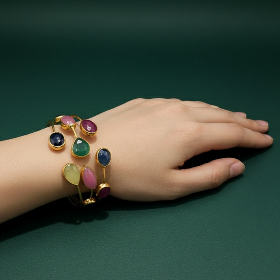 Gold Bangle with Purplish-Red Ruby Cabochons