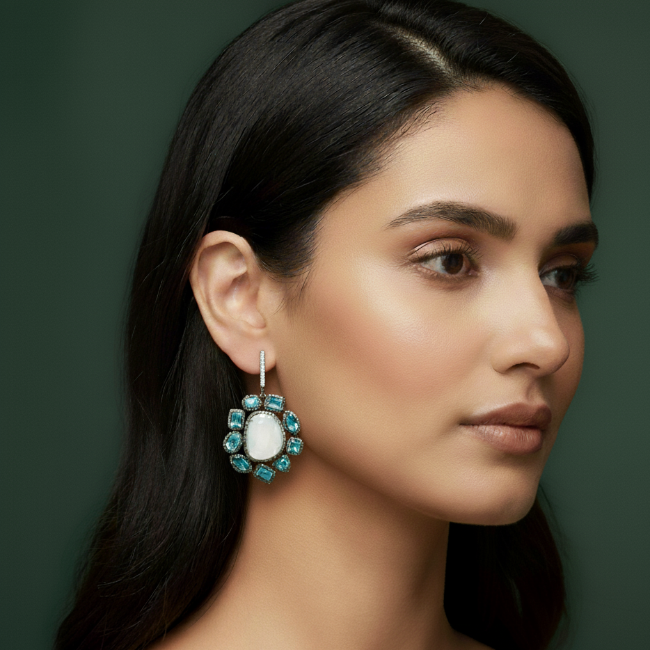 Silver Dangle Earrings with Blue Oval Cabochon Topaz