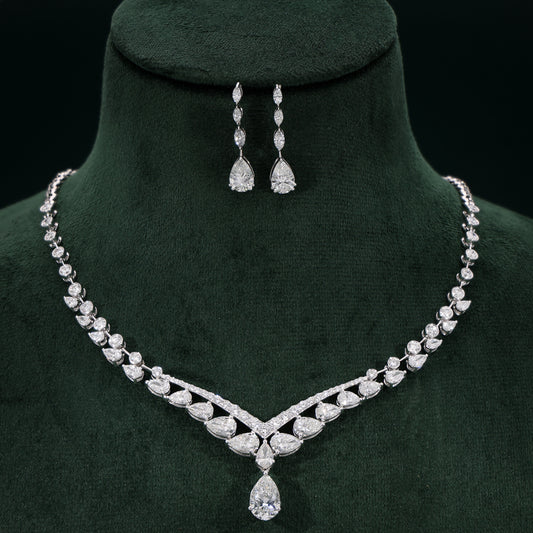 Aurora White Necklace Set on a green velvet stand
