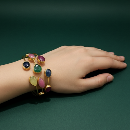 Gold Bangle with Purplish-Red Ruby Cabochons