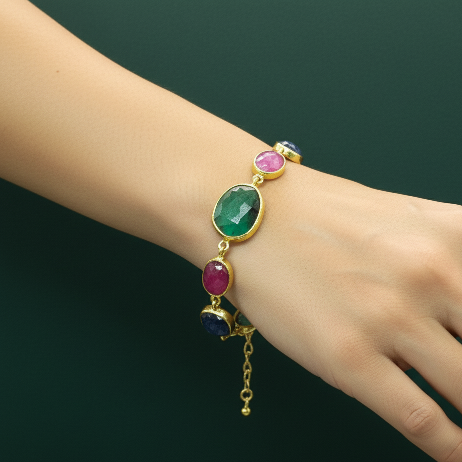Bracelet with colorful gemstones on a wrist against a dark background
