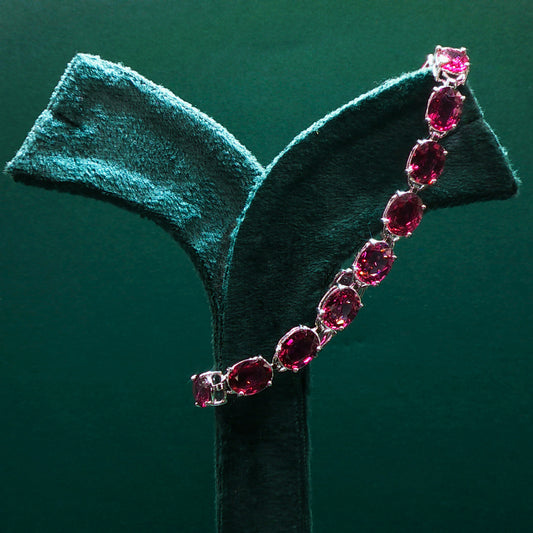 Sterling Silver Tennis Bracelet with Purplish-Red Ruby Cabochons