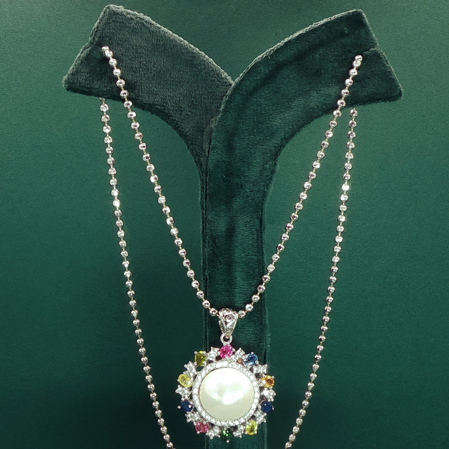 Silver Pendant set with Pearl Cabochon and Gemstone Halo