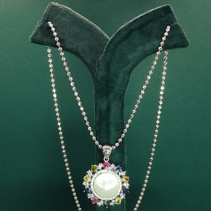 Silver Pendant set with Pearl Cabochon and Gemstone Halo