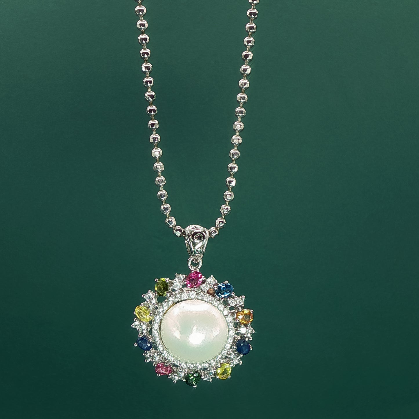 Silver Pendant set with Pearl Cabochon and Gemstone Halo