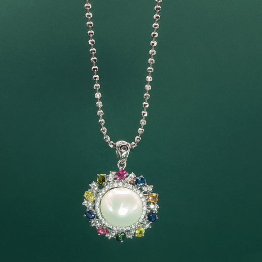 Silver Pendant set with Pearl Cabochon and Gemstone Halo