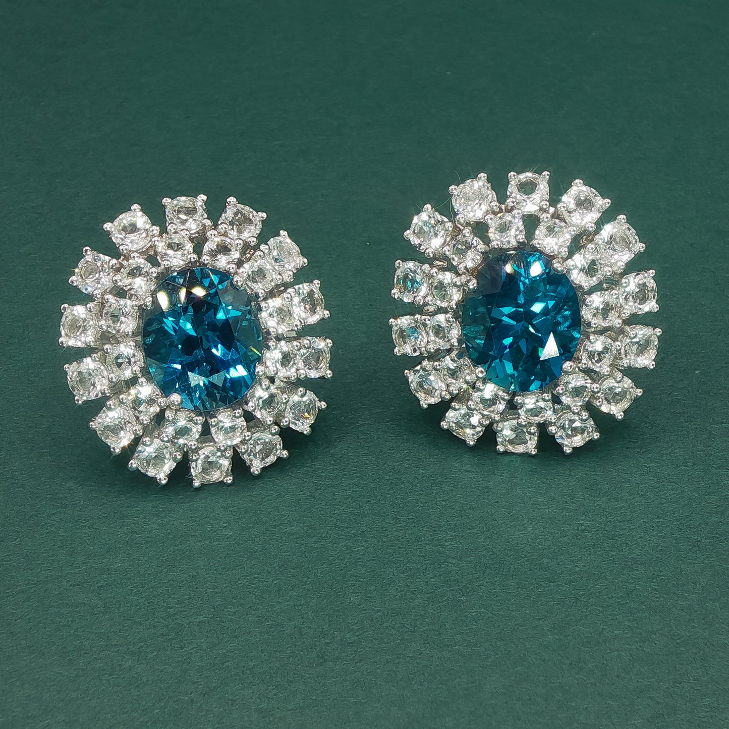 White Gold Stud Earrings with Oval Blue Topaz