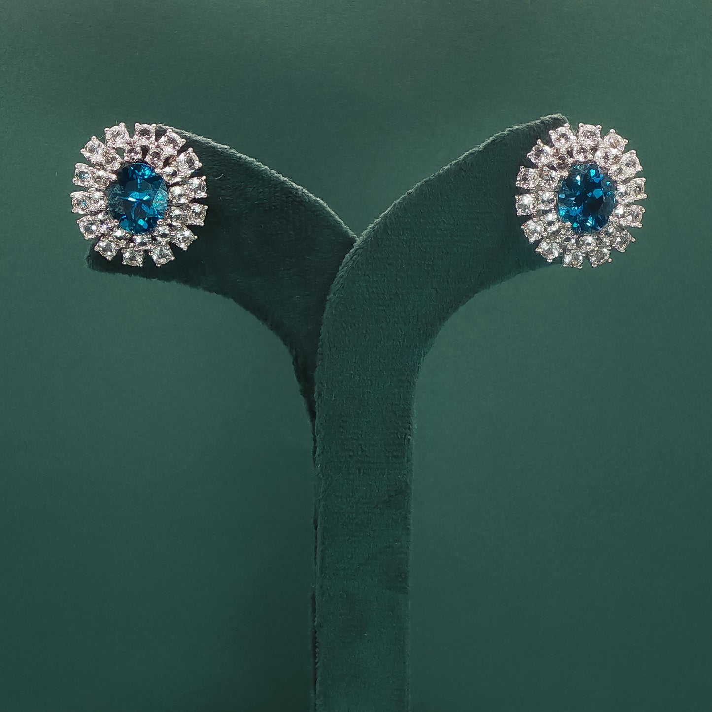 White Gold Stud Earrings with Oval Blue Topaz