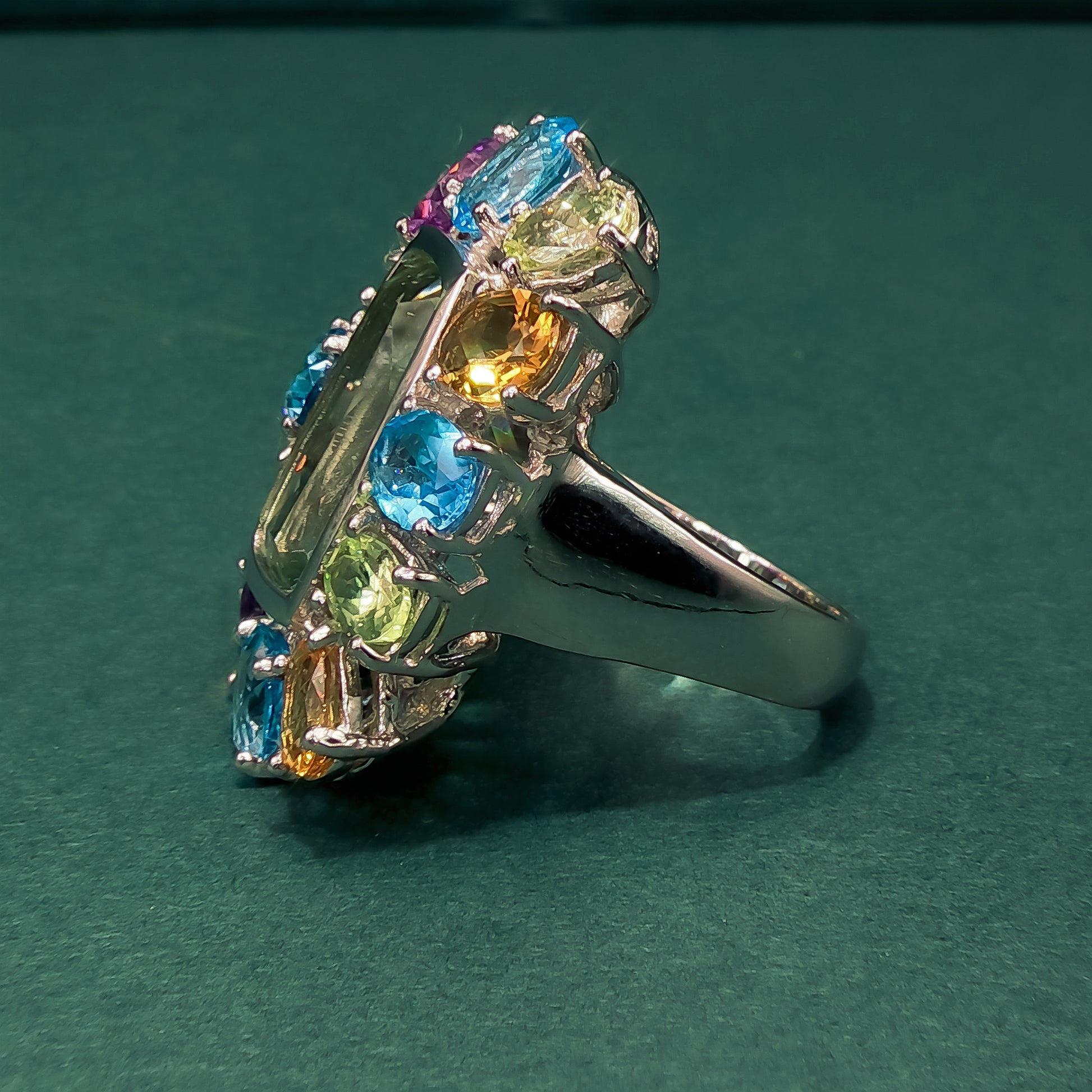 Multicolored gemstone ring on a dark background