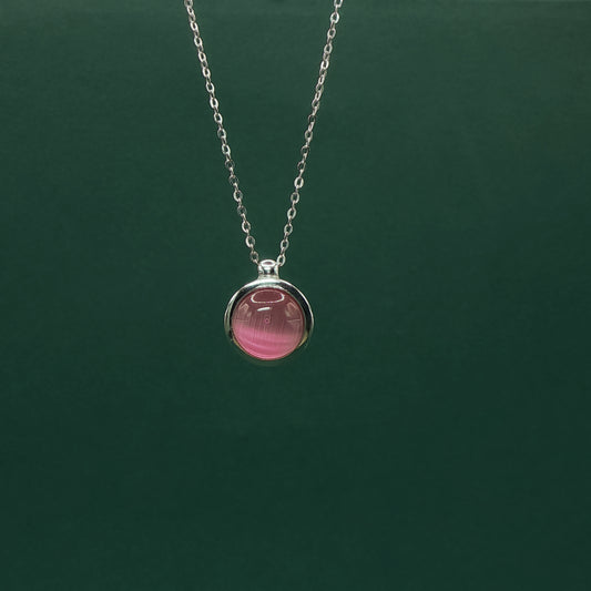 Rose Quartz Set with Elegant Cabochon-cut Reddish-Purple Gemstone