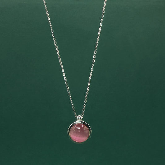 Rose Quartz Set with Elegant Cabochon-cut Reddish-Purple Gemstone