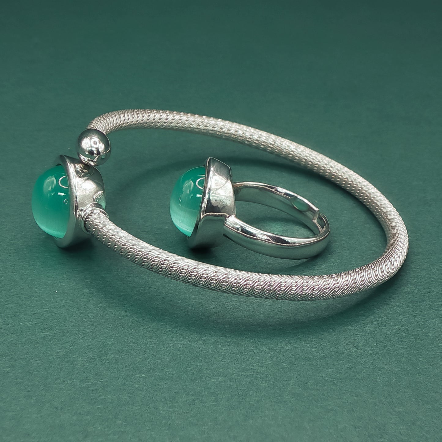 Silver Bangle with Bluish Green Catseye Cabochons