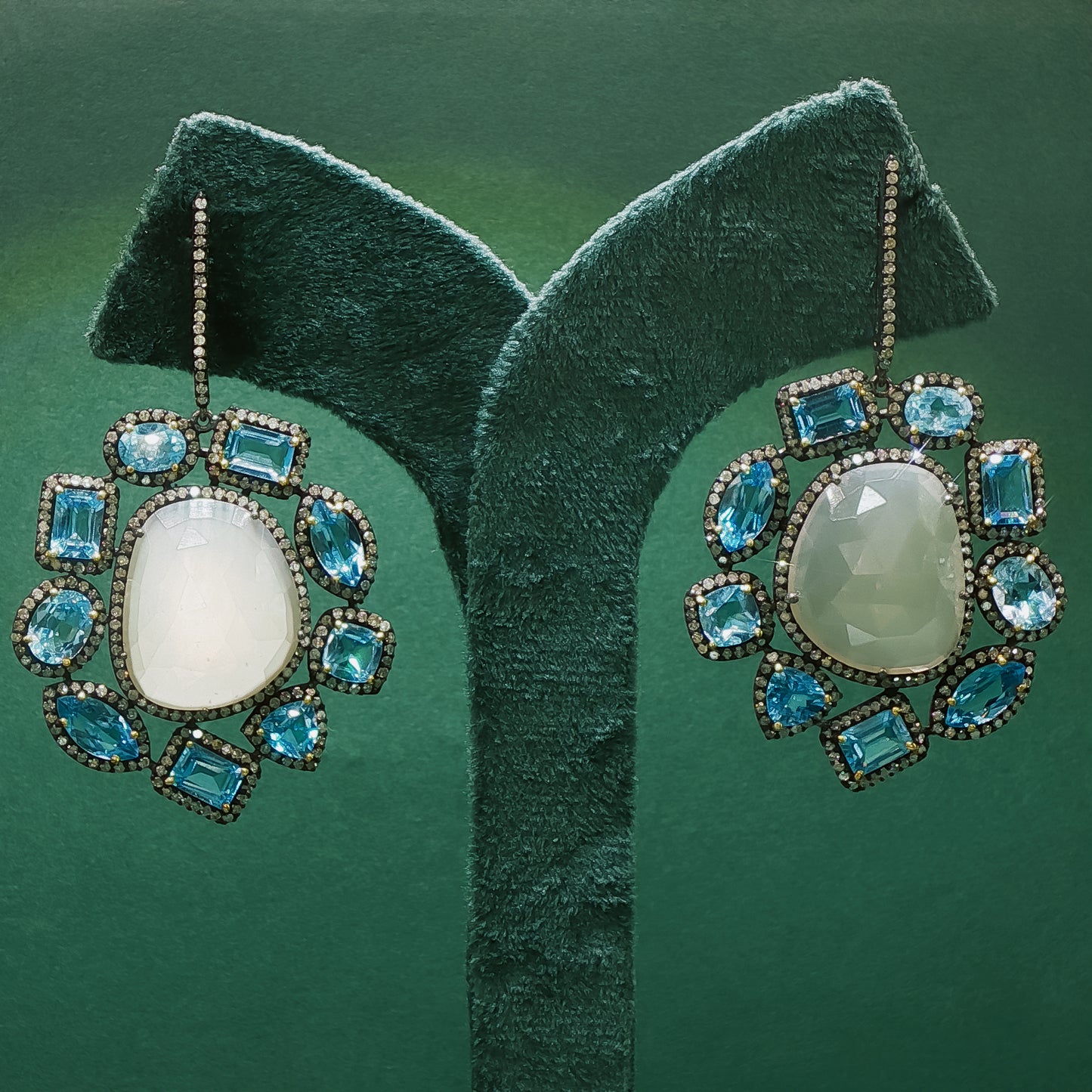 Silver Dangle Earrings with Blue Oval Cabochon Topaz