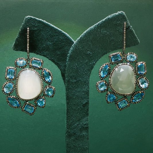 Silver Dangle Earrings with Blue Oval Cabochon Topaz