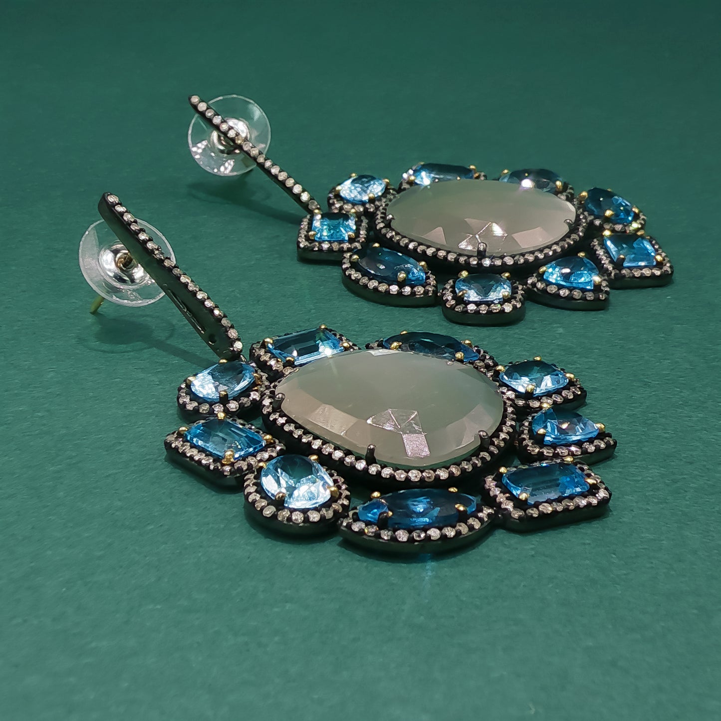 Silver Dangle Earrings with Blue Oval Cabochon Topaz