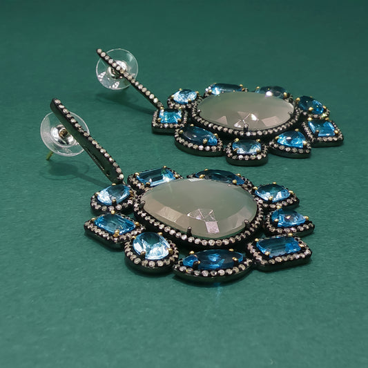 Silver Dangle Earrings with Blue Oval Cabochon Topaz