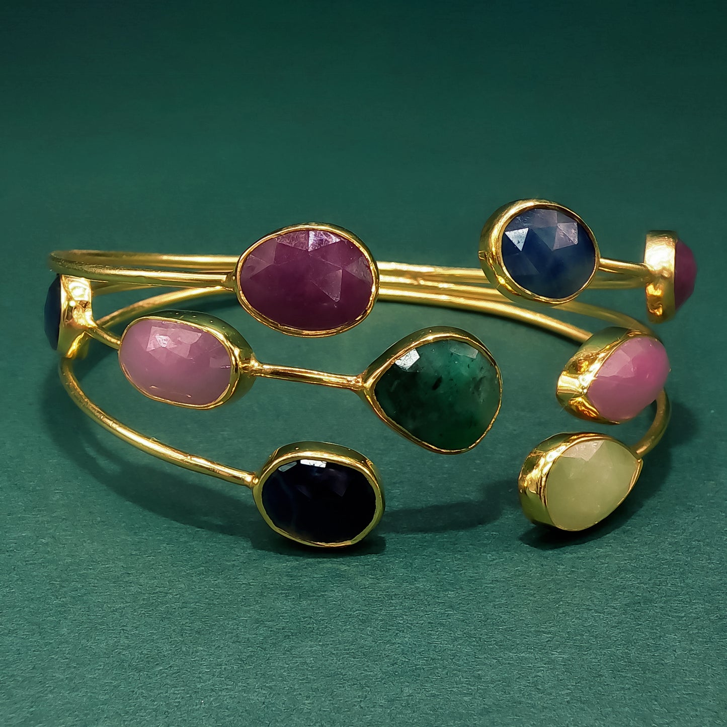 Gold Bangle with Purplish-Red Ruby Cabochons