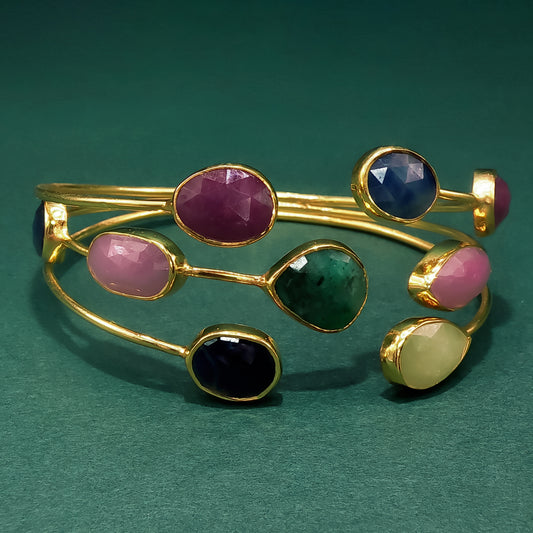 Gold Bangle with Purplish-Red Ruby Cabochons