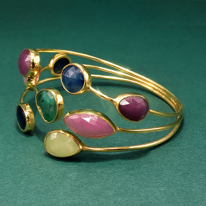Gold Bangle with Purplish-Red Ruby Cabochons