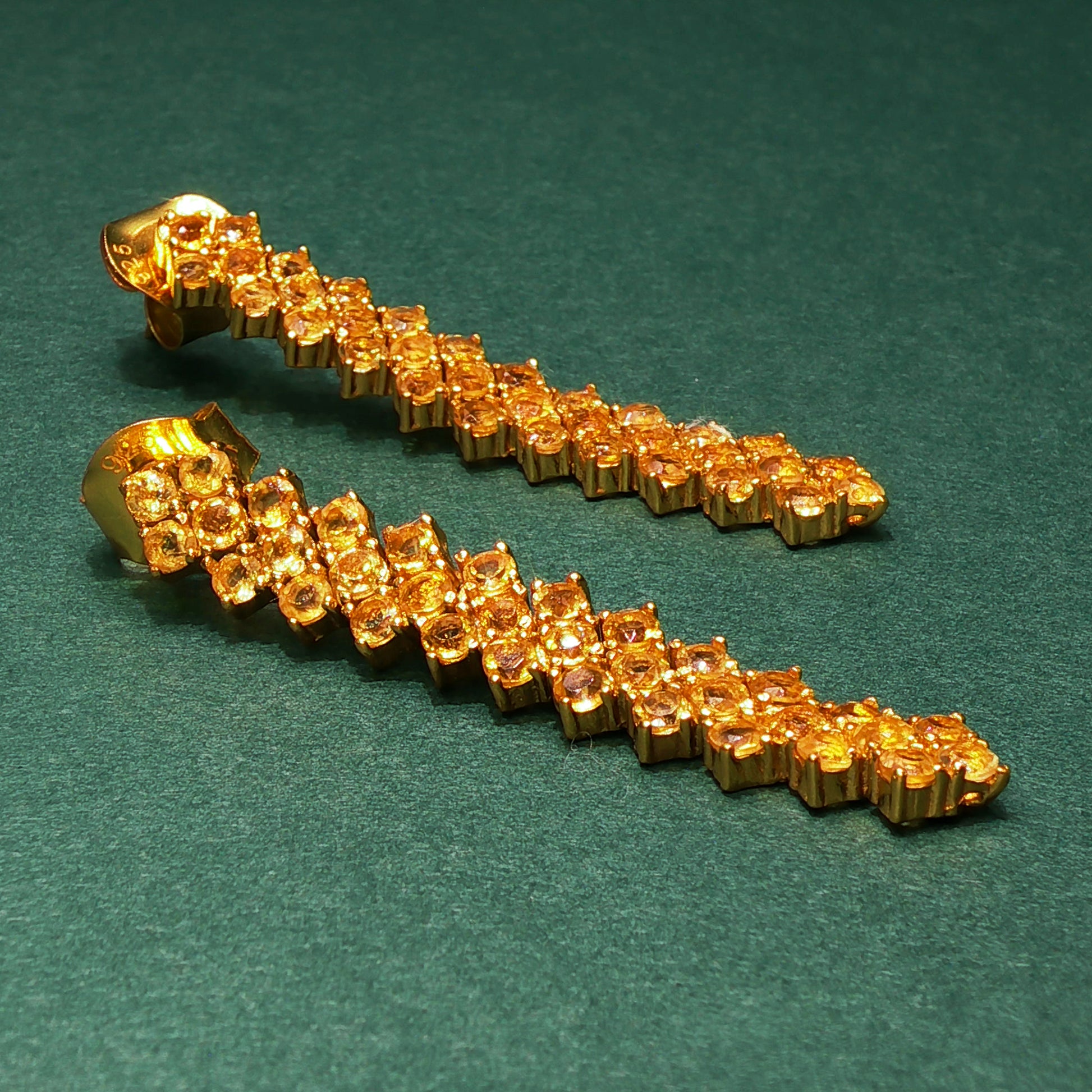 Gold-colored tool or device on a green background