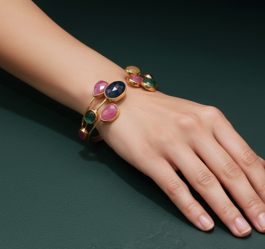 Gold Bangle Featuring Cabochon Cut Blue Sapphires